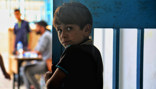 War Child in Gaza_oPt_Boy looking into camera_OCHA_Mohammad_Libed_210519
