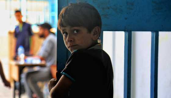 War Child in Gaza_oPt_Boy looking into camera_OCHA_Mohammad_Libed_210519