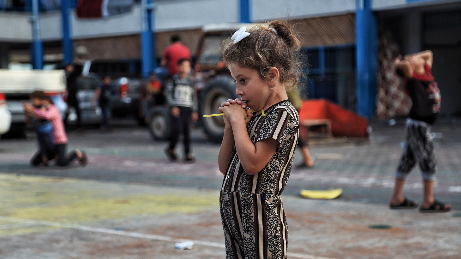 War Child in Gaza - oPt - Girl standing in the midst of the chaos - OCHA