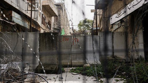 Fence with barbed wire in OPT near War Child safe space