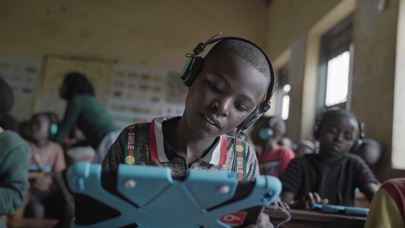 Child learning with a tablet form CWTL