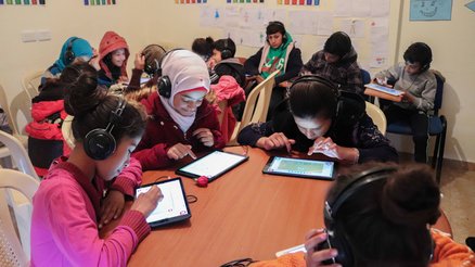 A classroom in Lebanon with children using Can't Wait to Learn, War Child's learning app