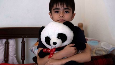 Adil from Syria is now living in Lebanon, where his panda bear helps him feel safe, alongside War Child's activities