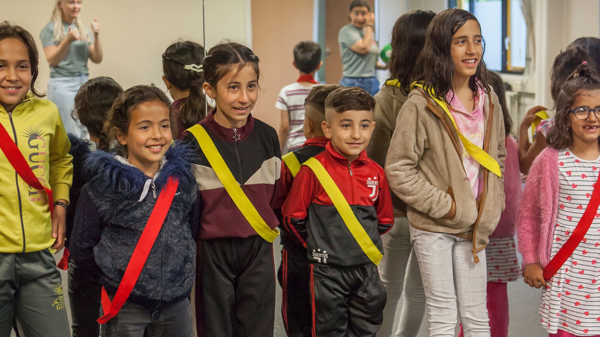 Refugee kids playing games during a TeamUp session at an asylum in The Netherlands