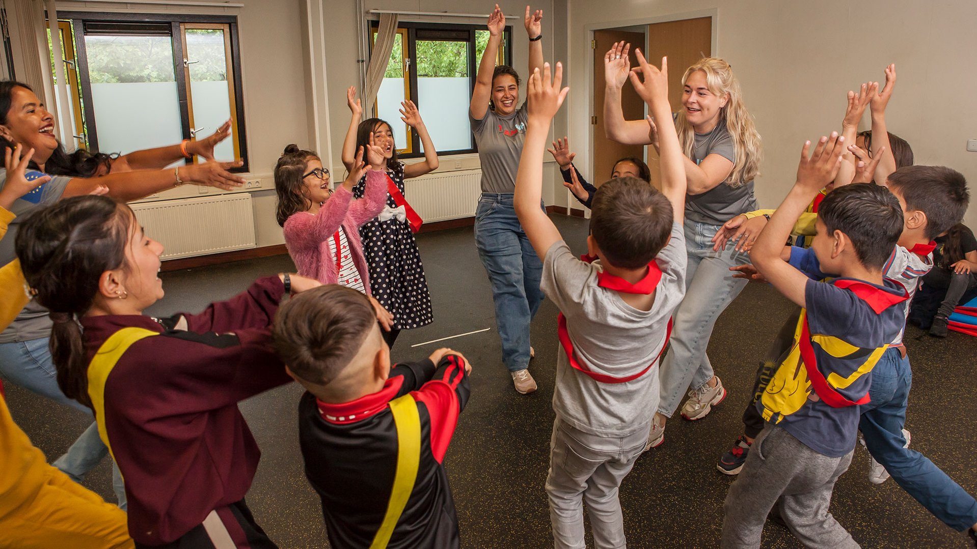 Refugee children playing and having fun at TeamUp session at an asylum in The Netherlands