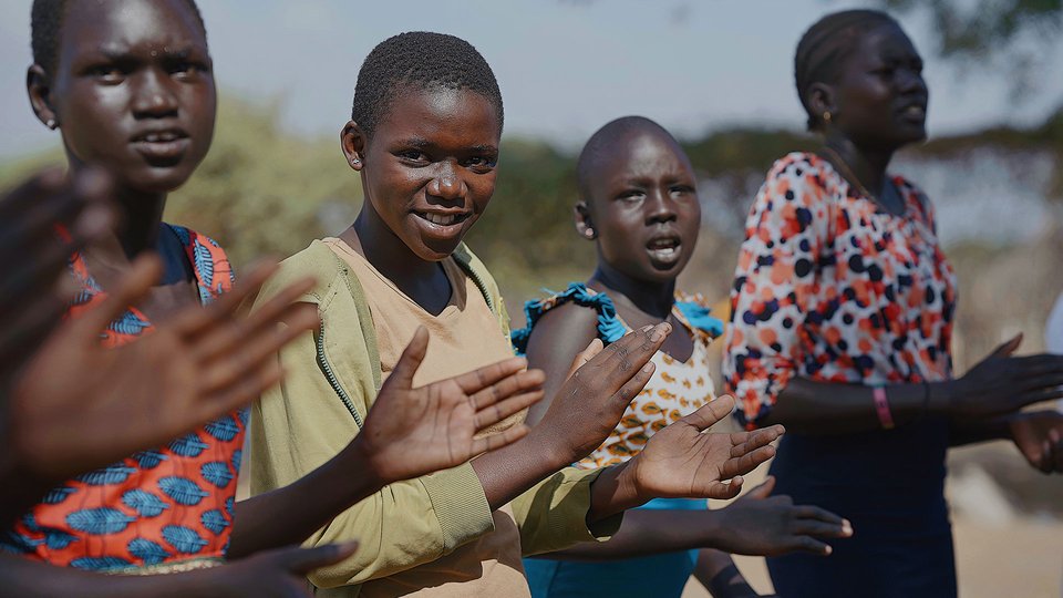 Adit is making new friends during TeamUp's sport and play activities from War Child